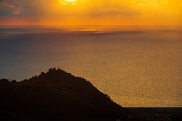 sunset over the Tyrrhenian Sea during a spring day with a cloudy sky, seen from Maierà, Cosenza