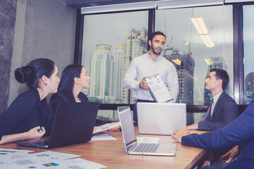 Group business people team meeting together while man presenting and explaining about planning and...