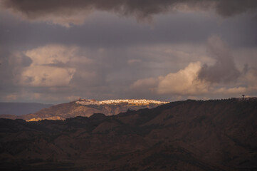 top view of the village of Grisolia with a cloudy sky in the background, Cosenza