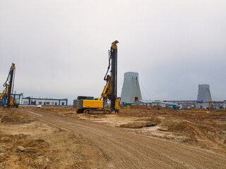 Innovative drilling rig technology transforming pile driving on construction site at dawn