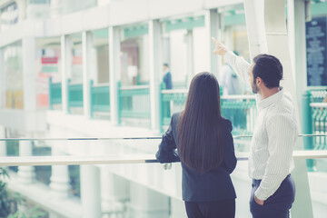 Obraz premium Two business people discussing about project in modern office, business man and partner talking together for planning and strategy of business, entrepreneur and secretary talking with confidence.