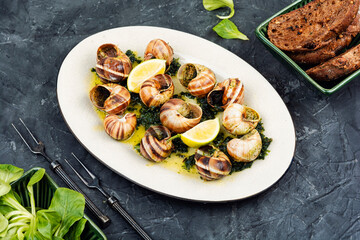 Baked snails with butter.