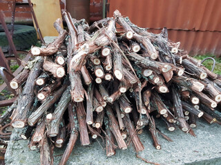 Stacked twigs ready for a cozy evening by the fire, showcasing the beauty of nature's materials in rustic surroundings