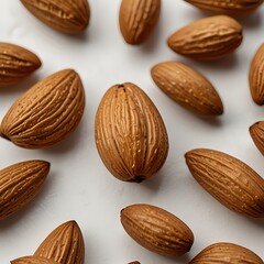 A repeating pattern of brown, oval nuts against a light background