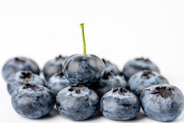 close-up of blueberries on white background