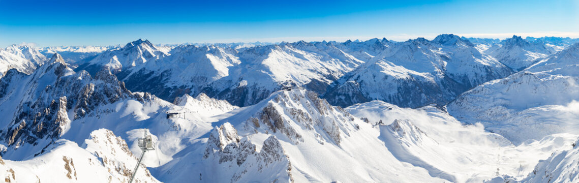 Wonderful wide majestic snowy austrian alps panorama in winter. beautiful mountain tourism sport and ski resort concept background