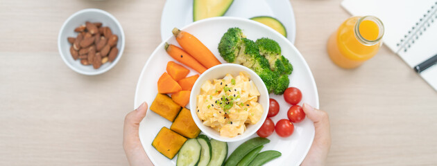 young female planning menu to eat ketogenic diet during weight loss program.