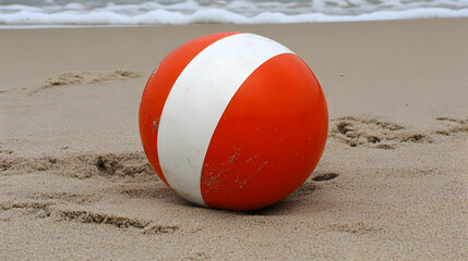 Obraz premium Beach Ball on Sand Realistic Photo