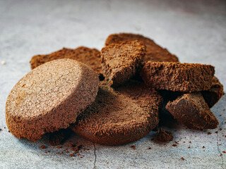 Close-up of coffee grounds from espresso machine. coffee ground on gray background