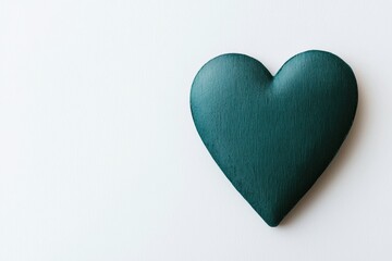 Fototapeta premium Green heart representing health and care on white background with copy space