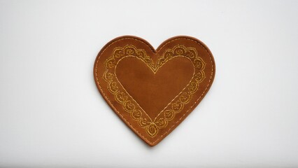 Obraz premium Decorative suede patch in heart shape, ideal for creative designs.