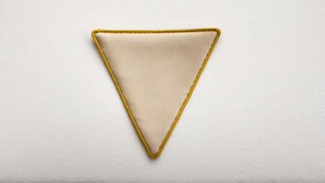 Premium triangle suede patch with clean stitching for crafts.