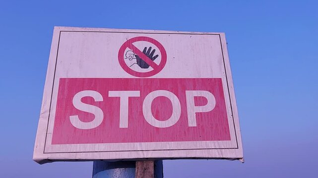 Traffic stop sign in the school yard close-up. Stop road sign. Stepchild.