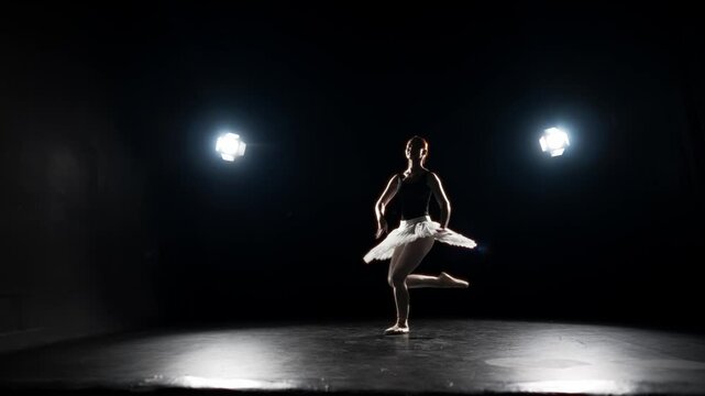 Talented ballerina jumping on stage, slow motion, grace and beauty of dancer. Classic ballet performance, solo of professional ballerina, hobby and profession, theatrical performance, school of arts