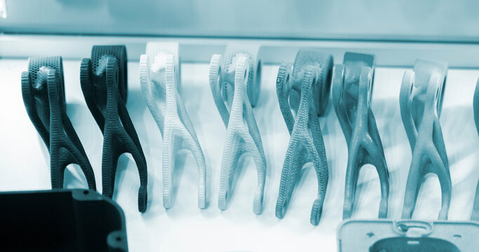 Models printed on a 3D printer from grey polyamide powder close-up