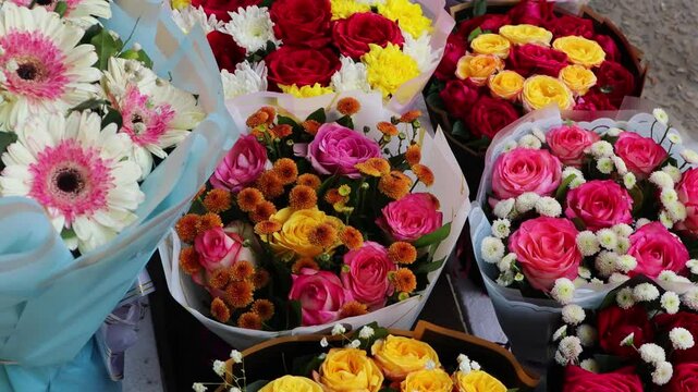 Bouquets of roses stacked in flower market 4k footage. 
