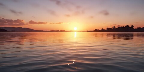 Obraz premium Softly fading sunset with ripples on the water surface, gentle, peaceful, serene landscape