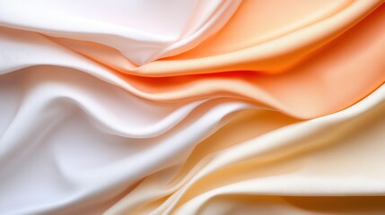 Fototapeta premium Elegant drapes of satin fabric in soft hues of cream and peach
