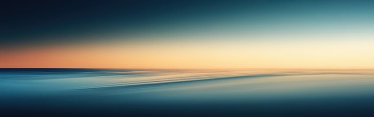 Smooth gradient background transitioning from deep blue to warm orange at sunset over a calm sea