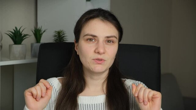 30 year old woman talking looking at camera, talking people.