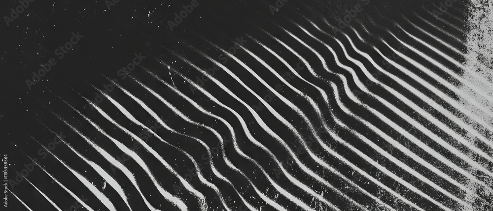 Poster Unique patterns created by light and shadow on a textured surface in monochrome