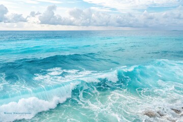Fototapeta premium Ocean wave breaking on the shore under a partly cloudy sky