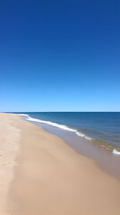 Obraz premium Seascape Photo: Beach and Ocean Under Blue Sky