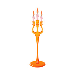 Gold floor candelabra or candle holder with burning candles.