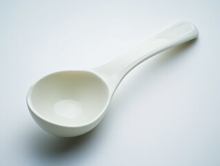 Small White Spoon on White Surface