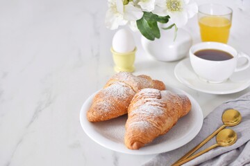 Breakfast with croissants on the table. Croissant day.