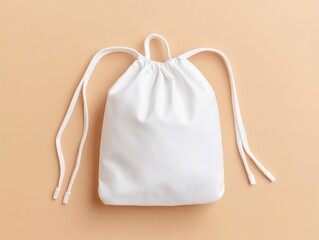 A plain white drawstring bag on a soft beige background, showcasing a simple and minimalist design ideal for various uses. product presentation mockup.