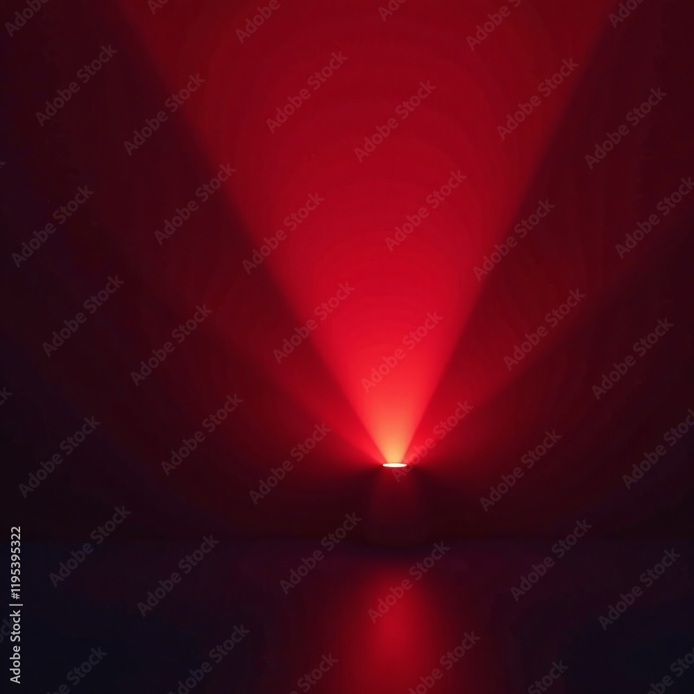Wall mural a vibrant red light beam creating an abstract atmosphere in a dark setting.