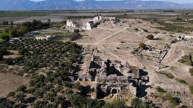 Footage of historical ruins, columns, ancient theater and temples in the ancient city of Miletus.