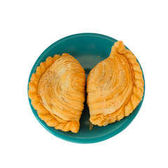 Fried curry puff or karipap in Thai on dishwasher .This pastry is asian traditional.