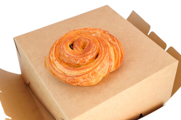 freshly baked cinnamon roll on white background.