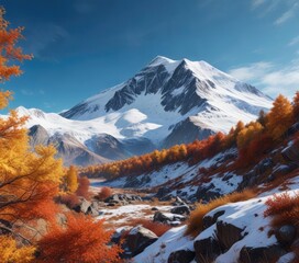 A dramatic snow-capped mountain against a blue sky with autumn colours, fall colours, mountain peaks, blue sky
