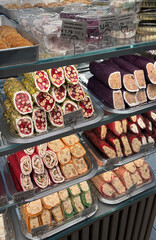 Showcase with assorted oriental sweets, featuring vibrant colors and intricate details, perfect for food promotions, menus, or cultural themes