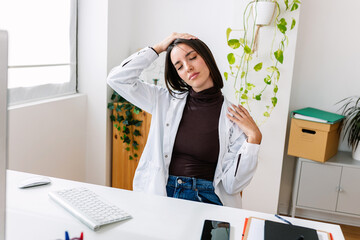 Young professional healthcare female doing stretching gymnastics exercise workout at office