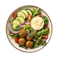 Falafel Salad on a plate - mixed greens, falafel, cucumbers, tomatoes, red onion, hummus, lemon tahini dressing