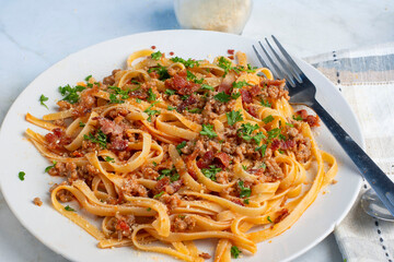 linquine  top with crumble  sausage, bacon  bits and parsley