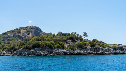 Fototapeta premium Gemiler Island or Saint Nicholas island located off coast of Turkey near city Fethiye or Oludeniz. Byzantine remains of several Greek churches. Gemile in Mediterranean Sea