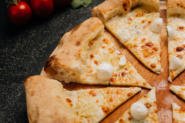 Sliced mozzarella pizza with golden crust, ideal for gourmet food lovers and culinary photography