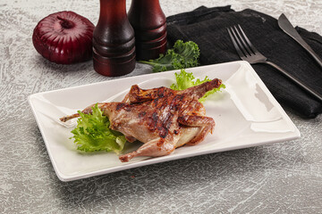 Grilled quail in the plate