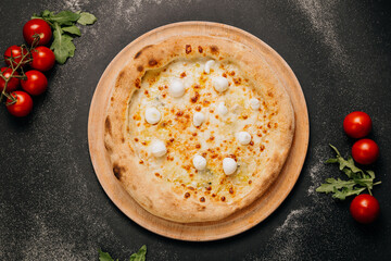 Delicious gourmet pizza with melted cheese and mozzarella balls, baked to golden perfection