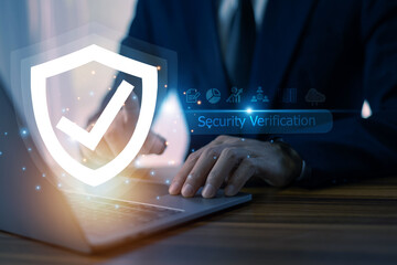 Businessman conducts a security verification process on his computer, safeguarding corporate information from cyber threats and potential breaches