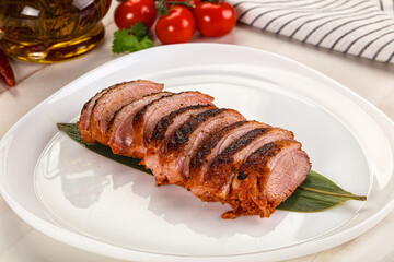 Sliced duck breast baked with cherry