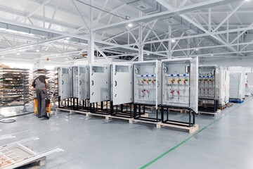 Industrial factory: caucasian male adult working in electrical assembly line