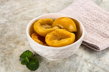 Canned marinated peach in syrop