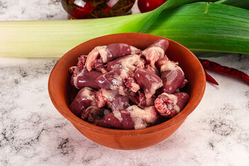 Raw chicken hearts in the bowl