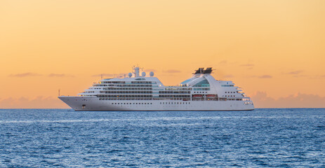 A Cruise Ship Off Shore at Sunset